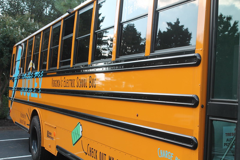 Image of an Electric School Bus with alternative fuel imagery on the paint job.